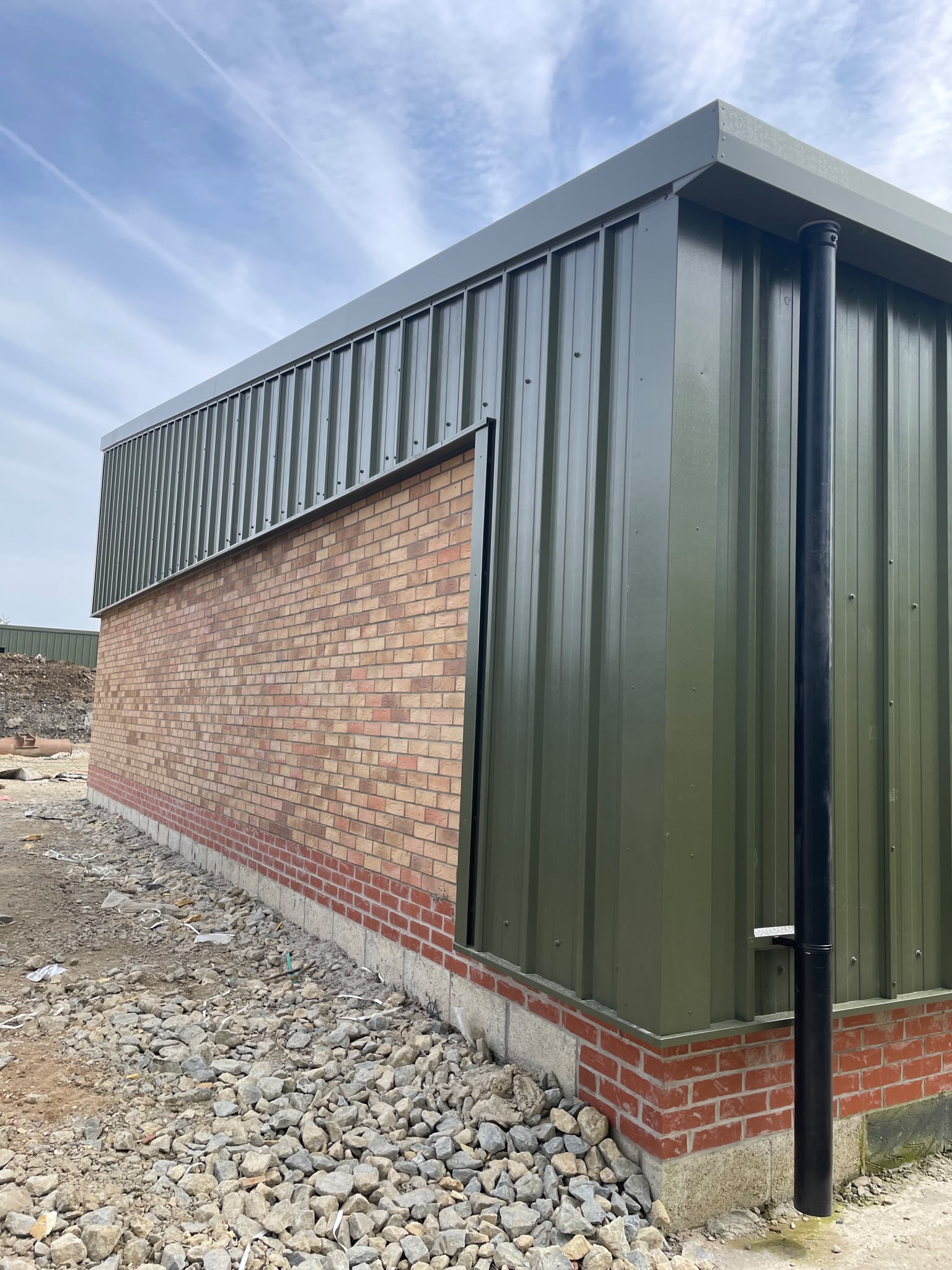 Commercial cladding installation: full cladding install on new build workshop units with a brick base