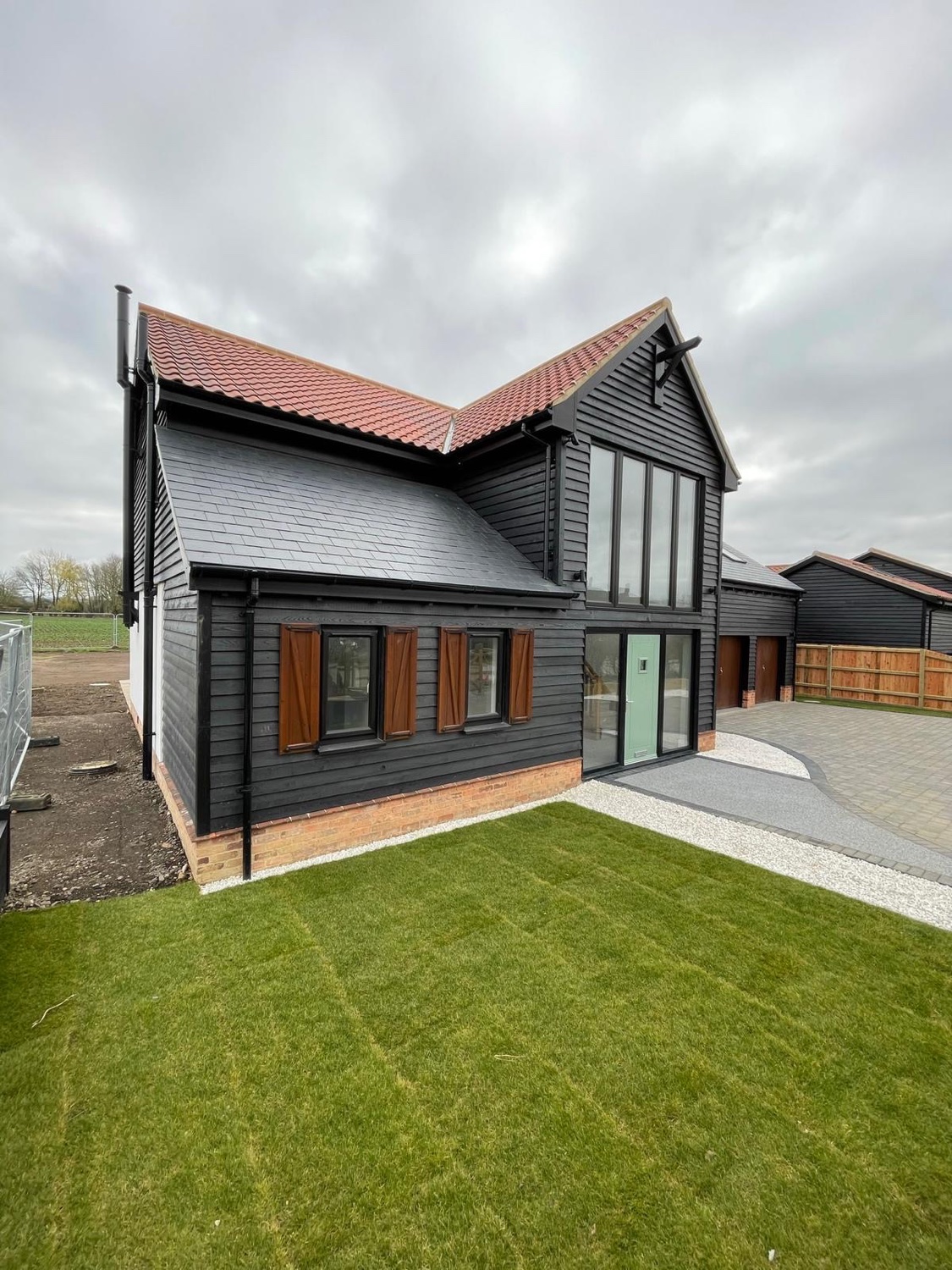 House cladding installation: black timber style cladding installed on a residential barn conversion